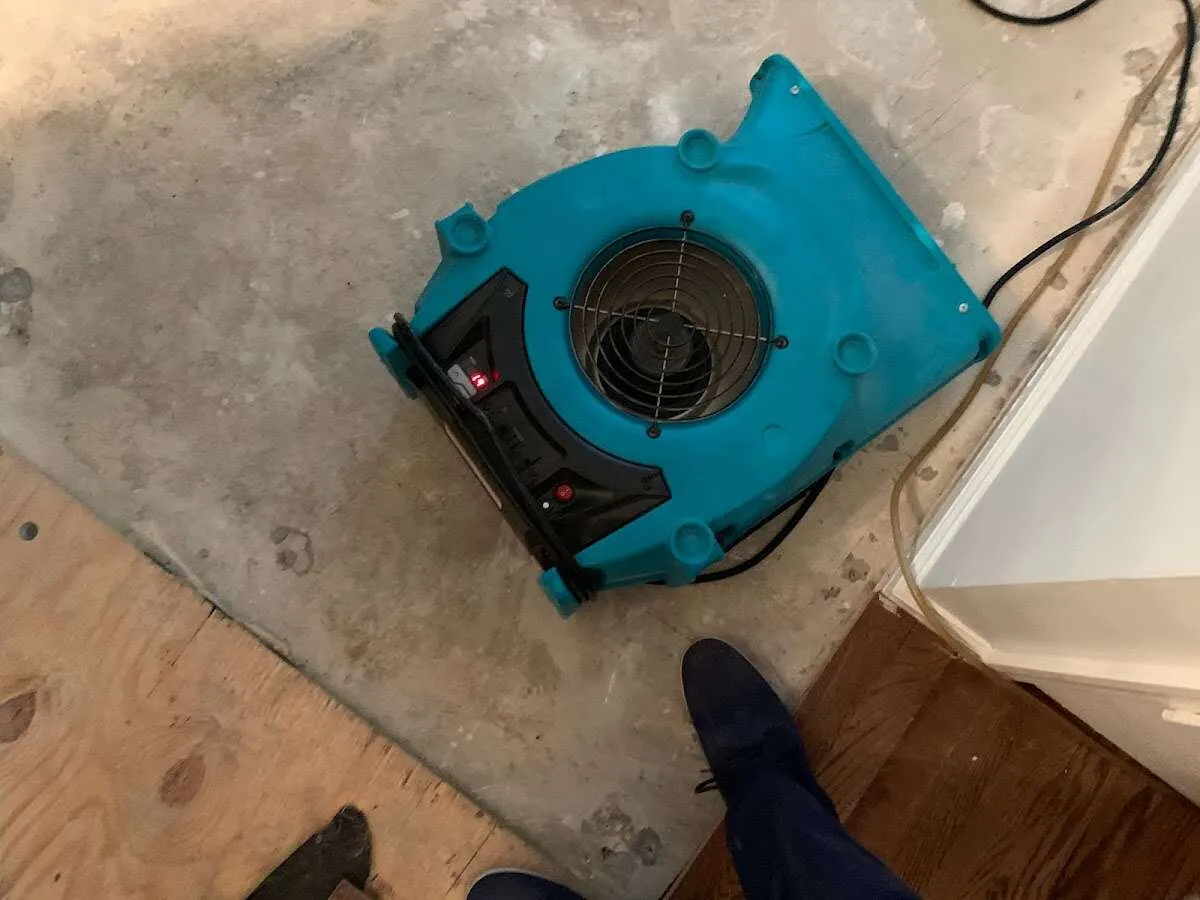 Air mover drying subfloor during Commercial Water Damage Restoration in Shamong